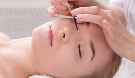 woman having eyelash tinting